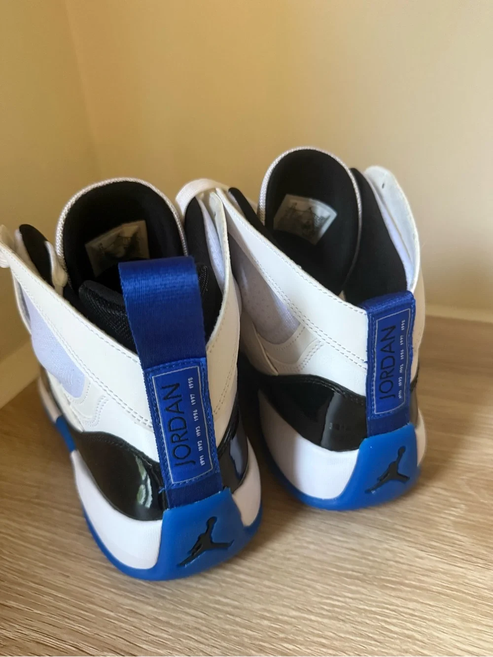 Jordan Retro High-Top Sneakers in White, Black & Blue